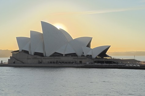 Sunrise sets the Sydney Opera House aglow.