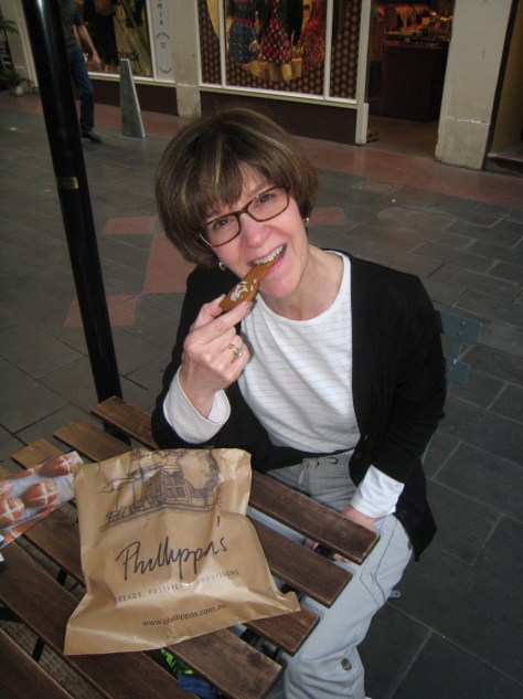At the bread shop stop, Betsy finds that woman cannot live by bread alone and bites the head off an Easter bunny cookie.